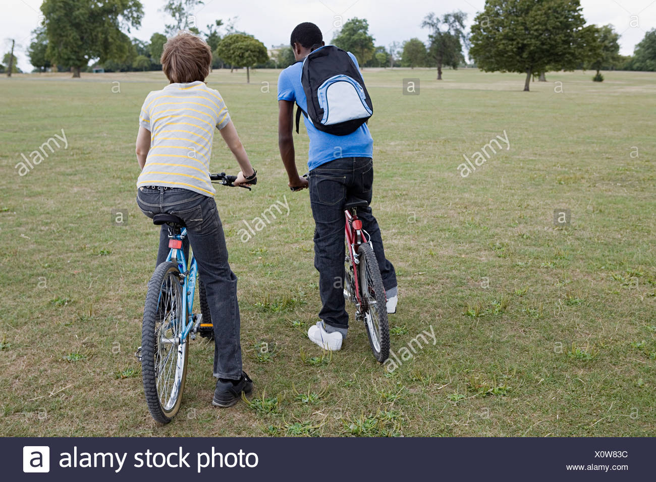 Two Boys Riding Bikes In High Resolution Stock Photography and Images