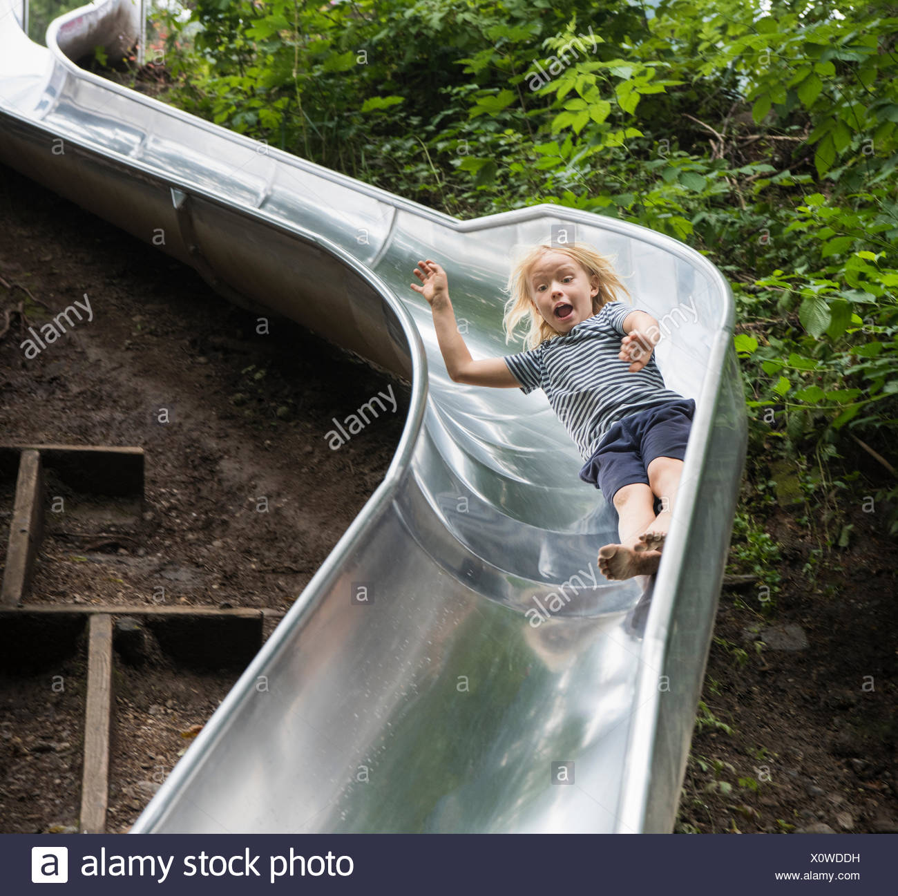 Sliding Down The Slide Stock Photos & Sliding Down The Slide Stock