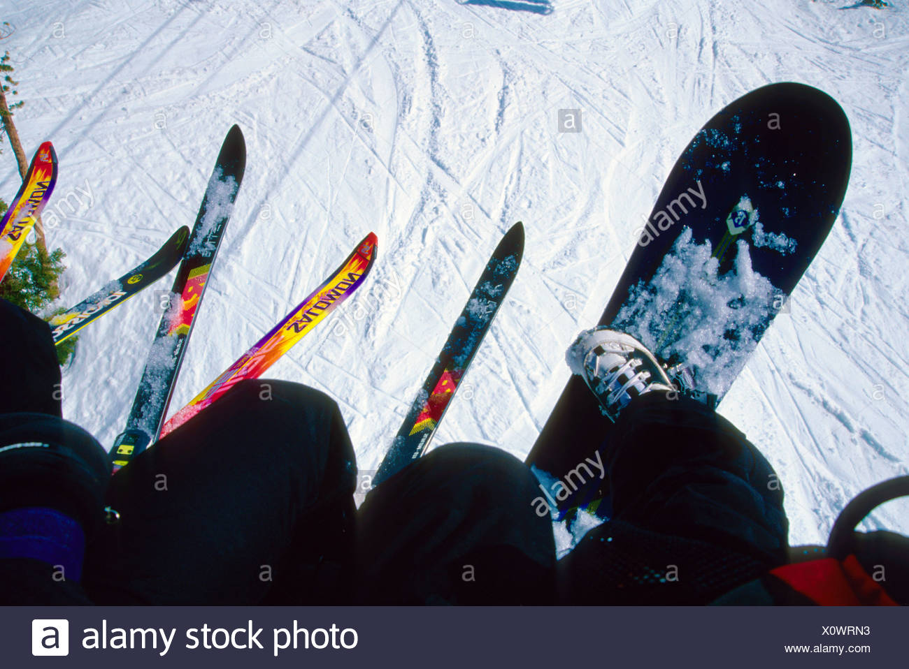 Skiiers And Snowboarders Riding A Chair Lift At Mammoth