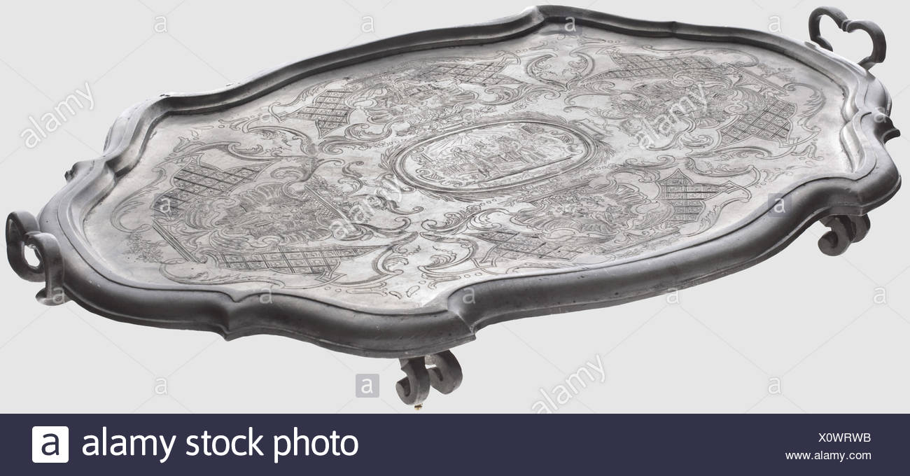 A Decorative Tray With Engravings Saxony Mid 18th Century Pewter A Large Foil Curved Tray With Distinctly Offset Profiled Rim Two Curved Handles On The Sides Four Feet In The Shape Of Double Volutes Two Parts Re Soldered The Entire