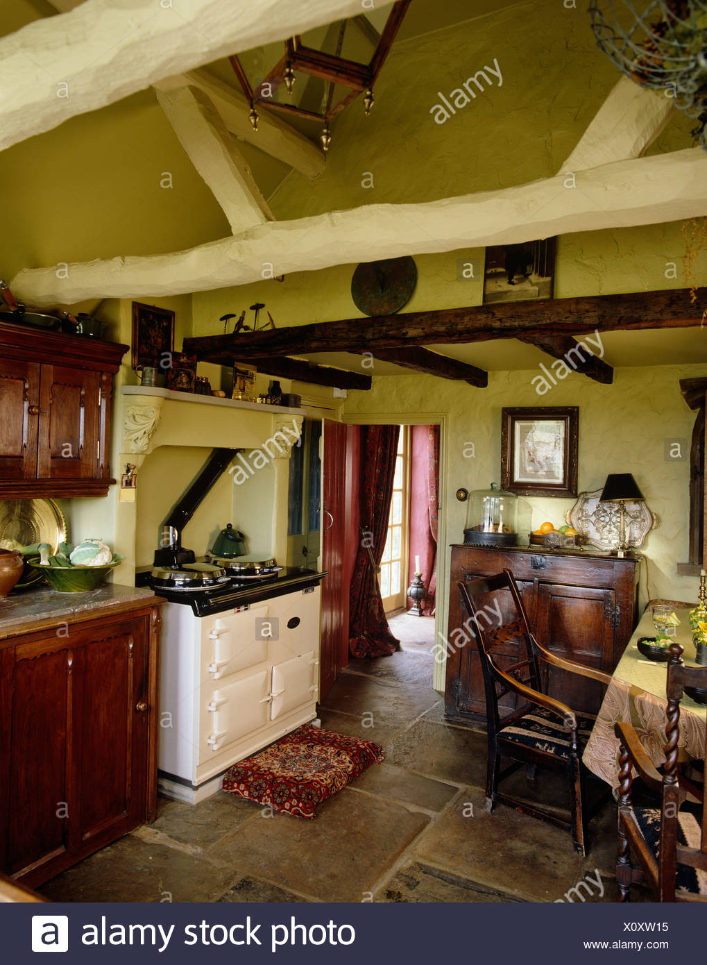 White Aga Range Oven Set In Recess In Country Kitchen With