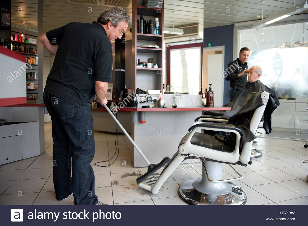 Barber Cleaning Floor Hairdresser Salon High Resolution Stock
