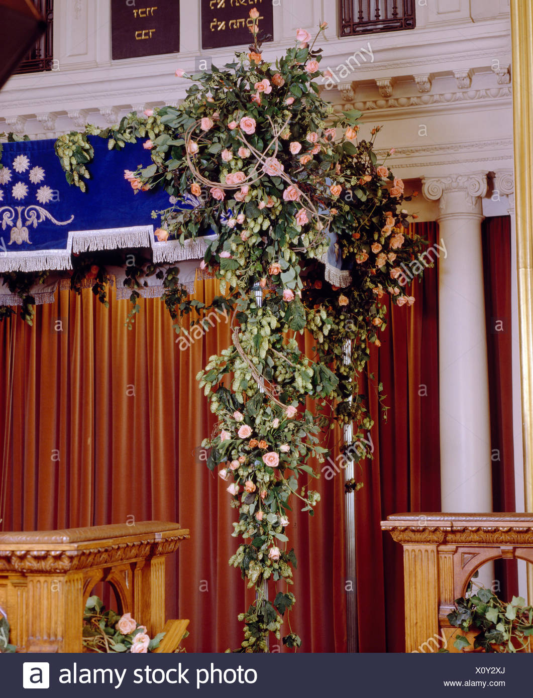 Pink Roses In Sumptuous Floral Arrangement In Country Church
