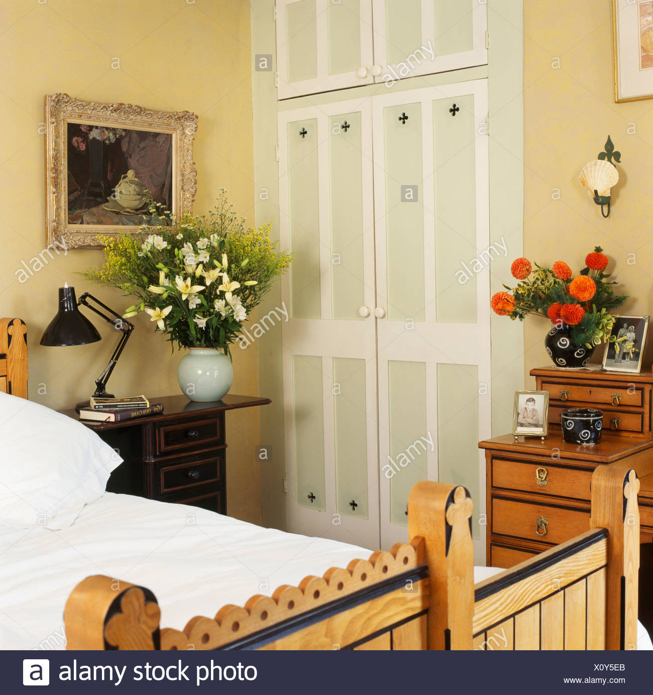 Fitted Wardrobe With Painted Doors In Cream Bedroom With White