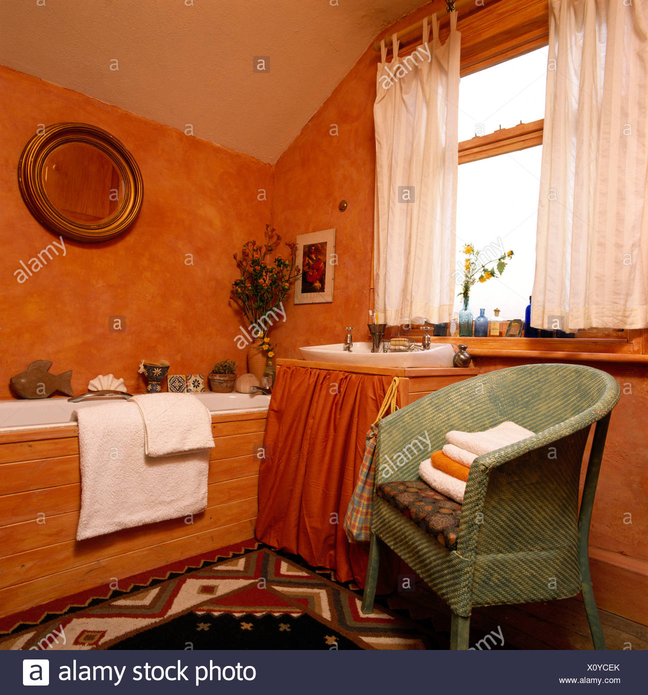 Painted Lloyd Loom Chair And White Curtains In Orange Economy