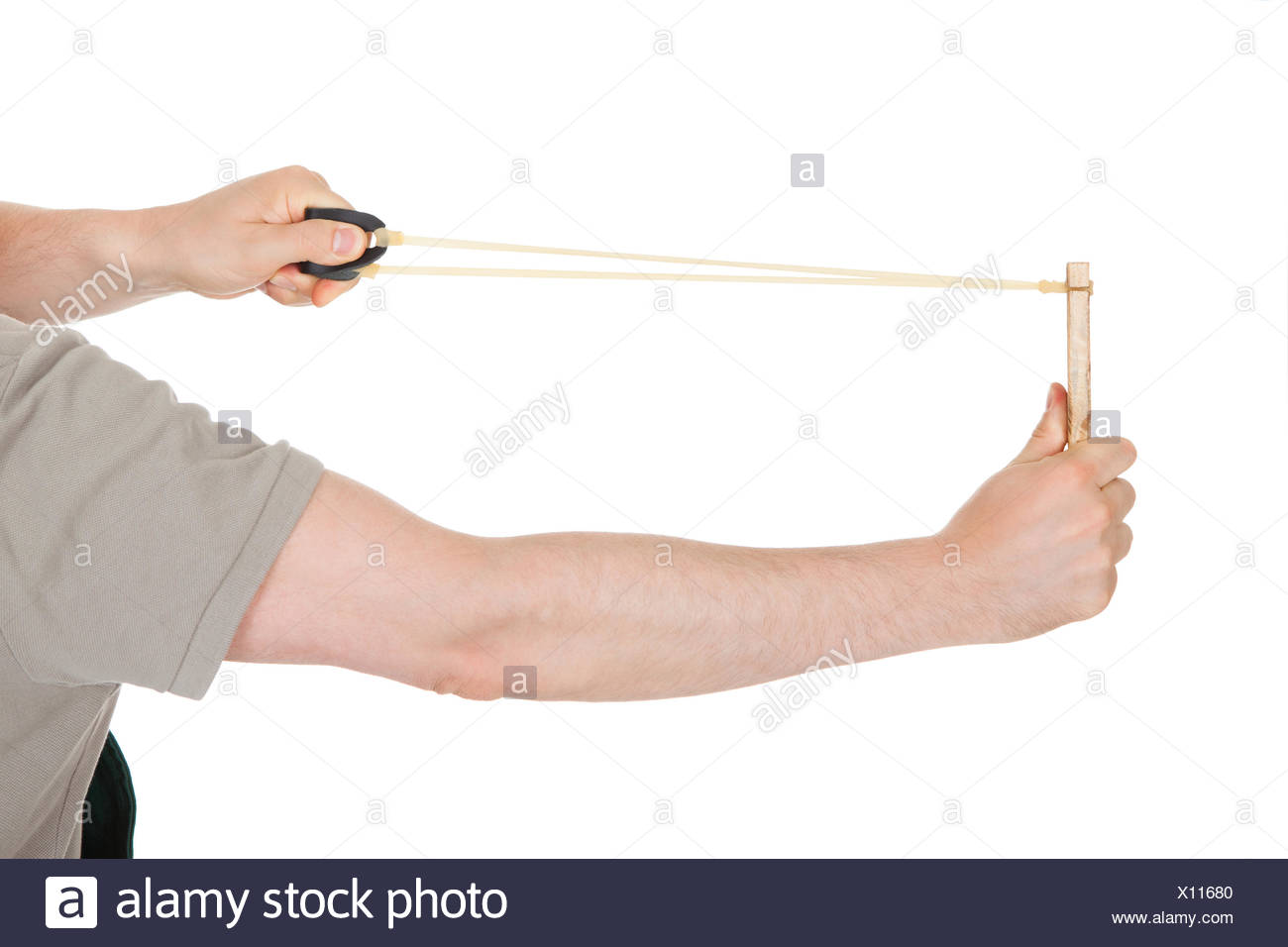 Close Up Of Hand Pulling Sling Shot On White Background Stock Photo Alamy