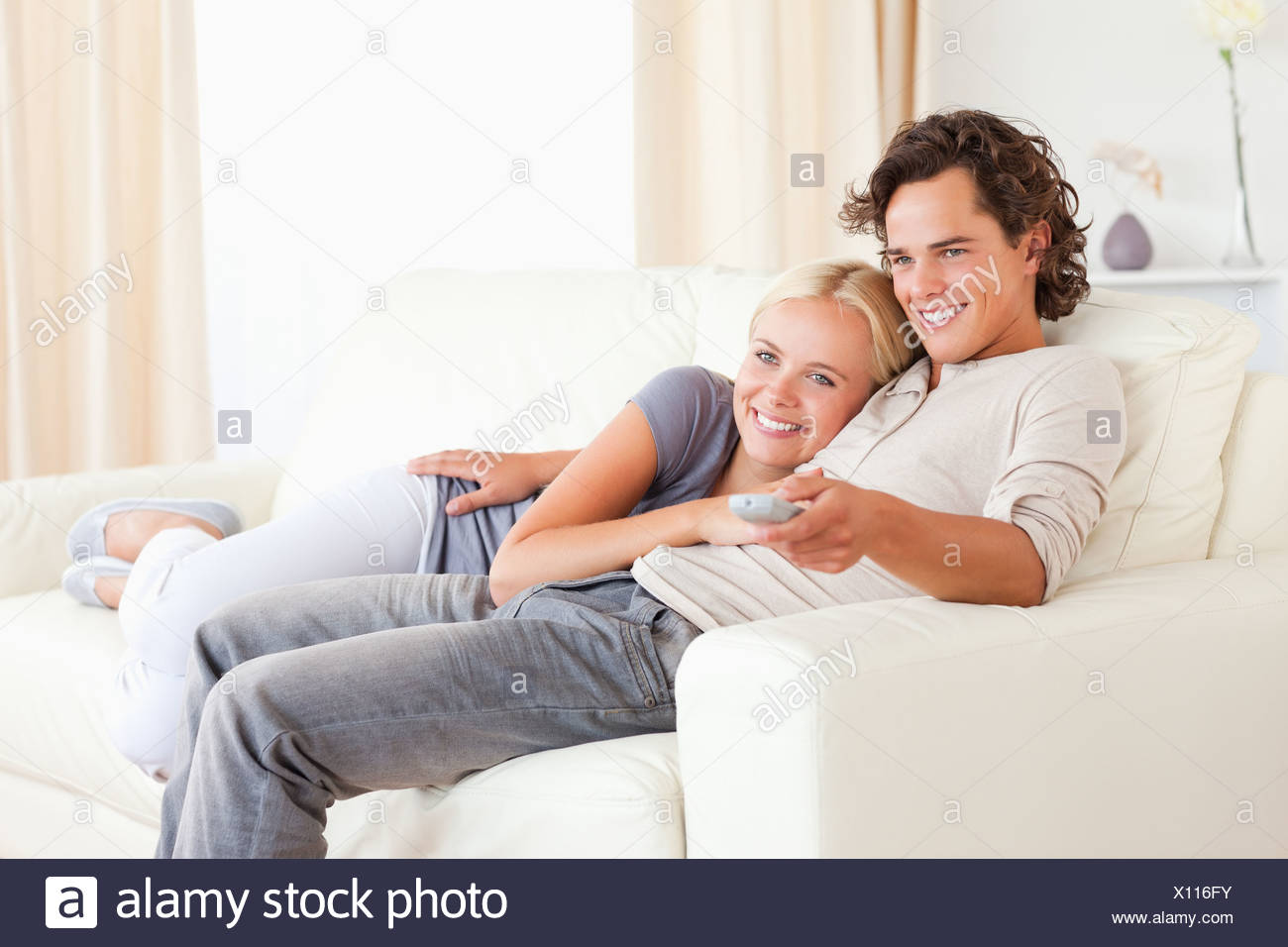 Couple Cuddling Watching Tv Stock Photos Couple Cuddling