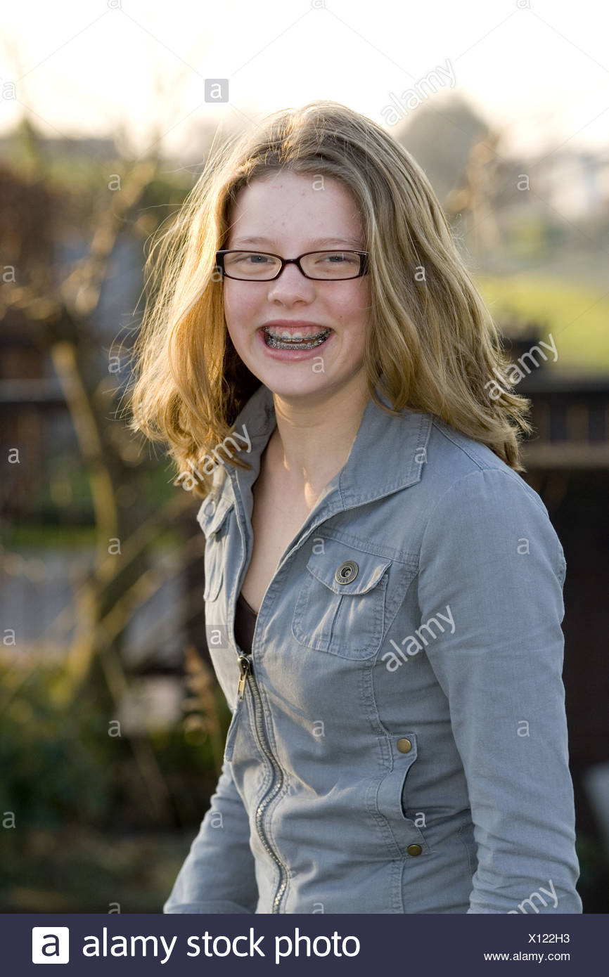 Happy Portrait Teenage Girl Age 12 With Dental Braces Smiling And