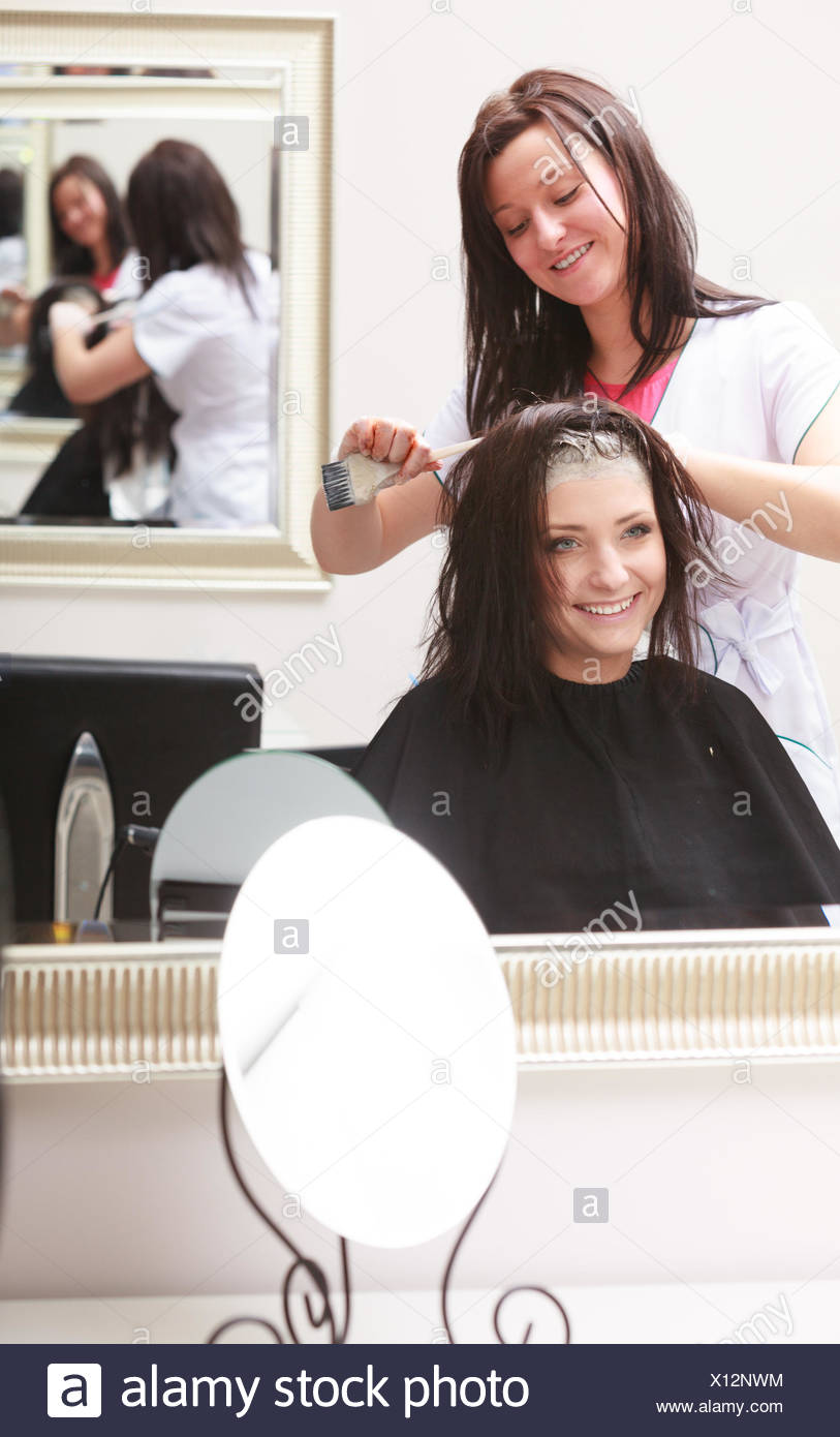 Brunette Woman In Hairdressing Beauty Salon Girl Dying Hair By