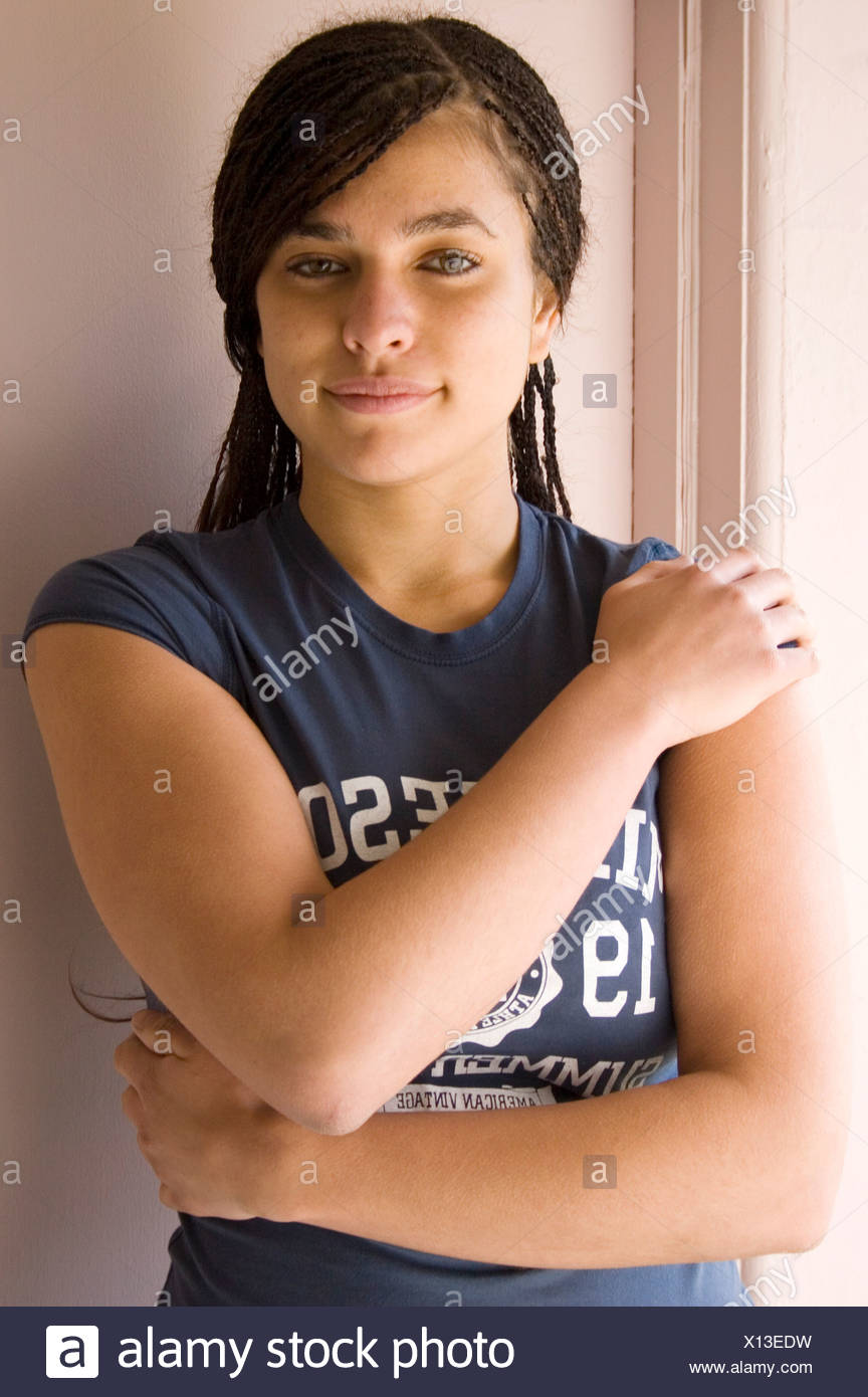 Portrait Mixed Race Teenage Girl With Braided Hair Extensions