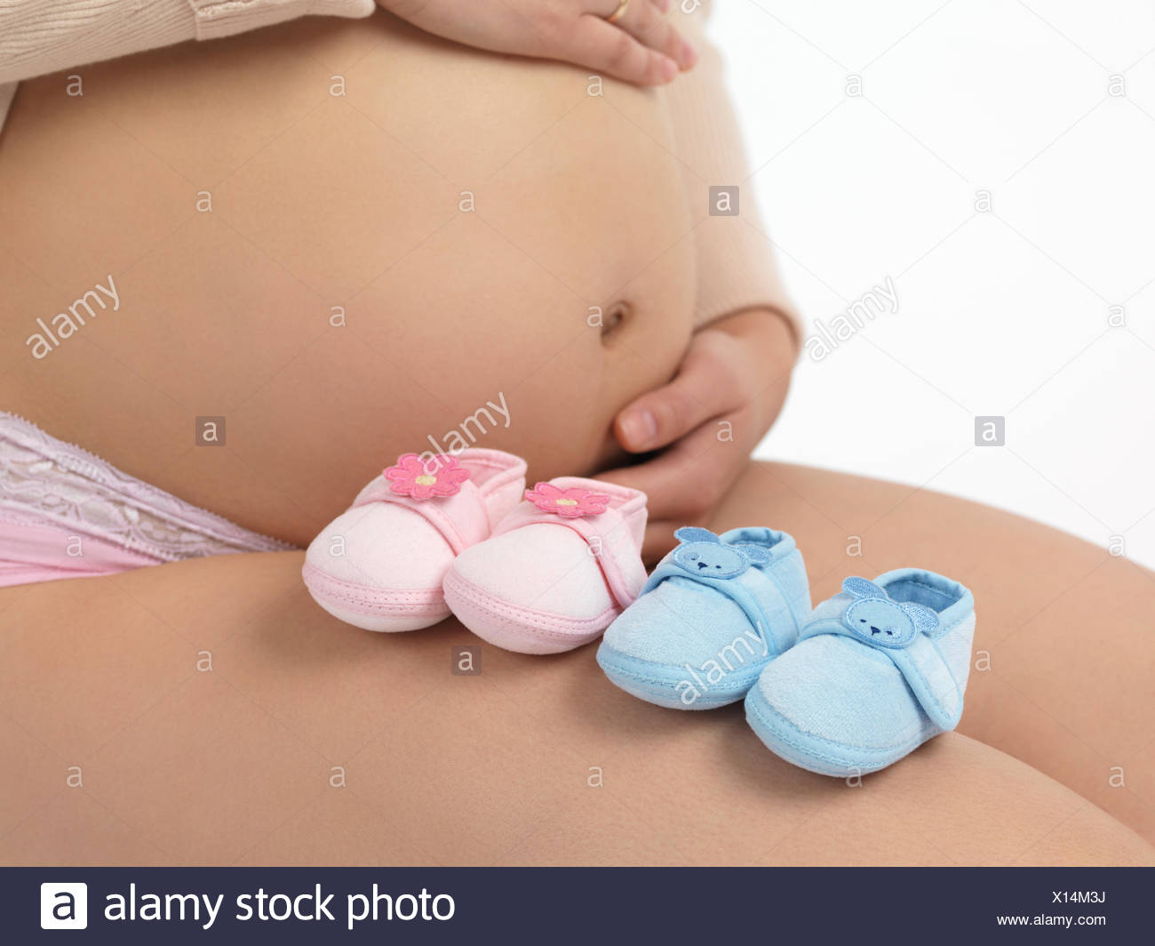 pink and blue baby shoes