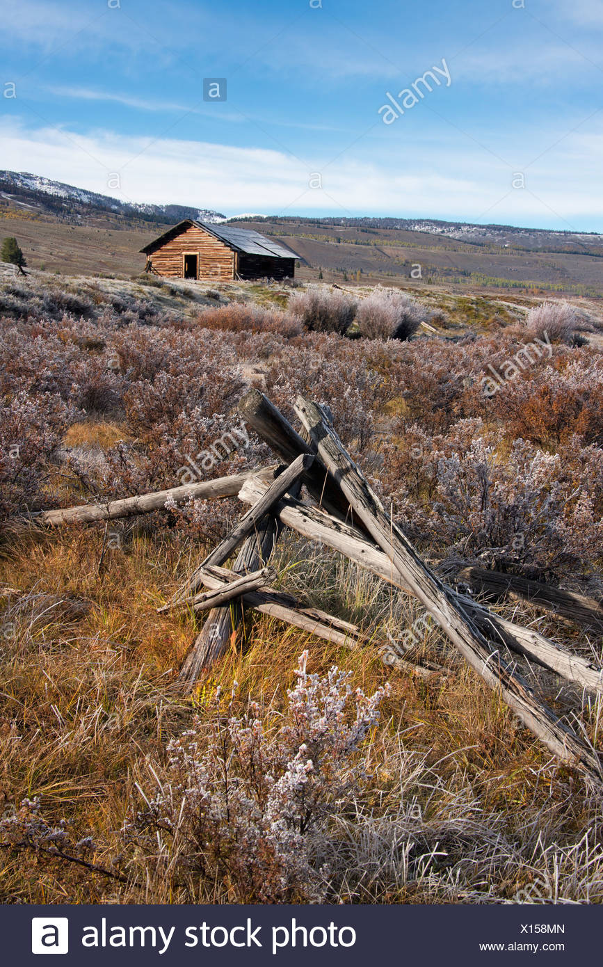 Broken Fencing On Grassland And A Barn In The Open In The Green