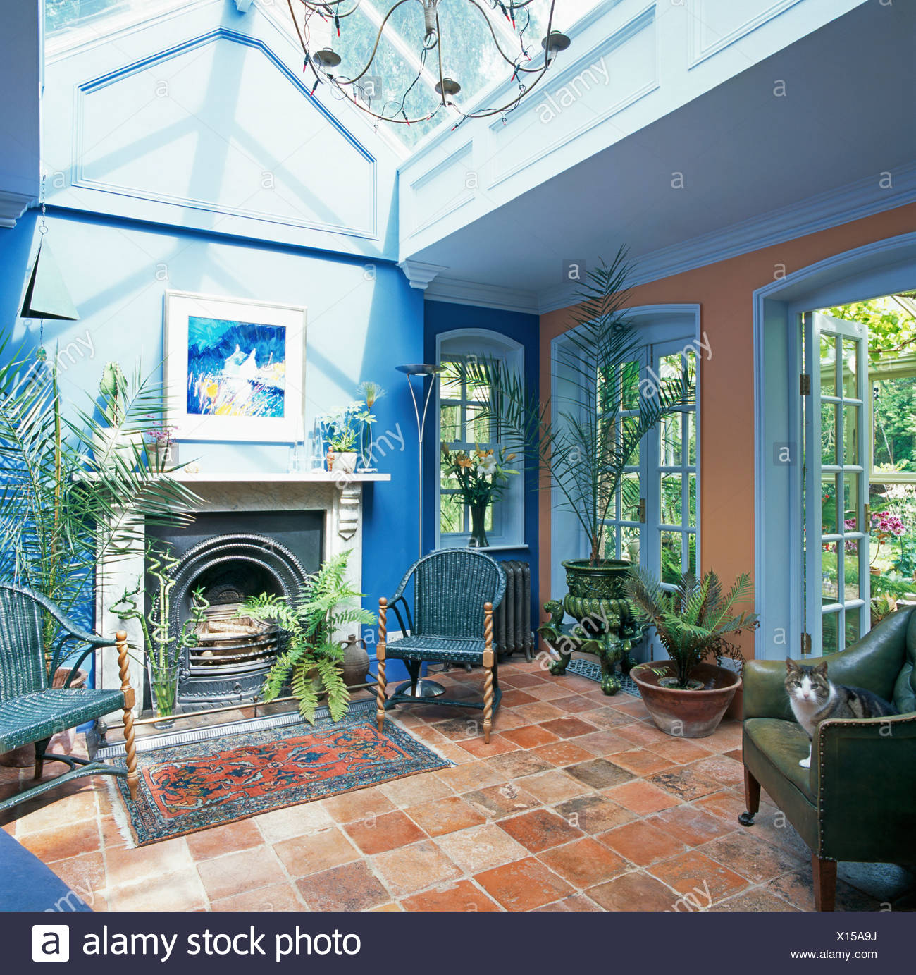 Terracotta tiled floor in conservatory living room with ...