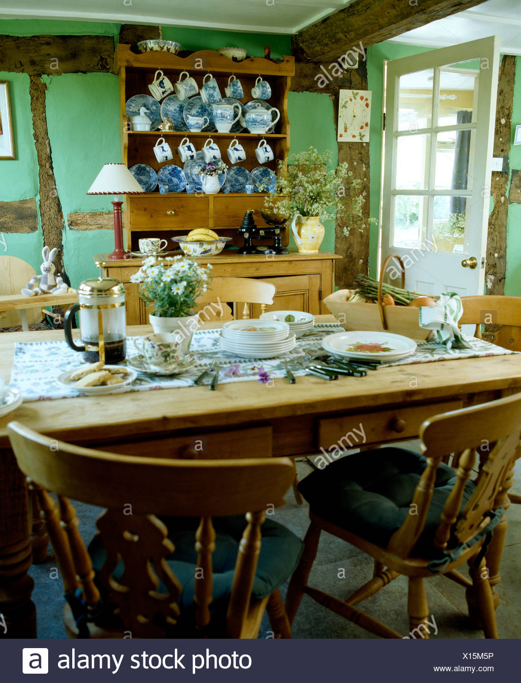 Pine Chairs At Pine Table Set For Breakfast In Pale Green Country