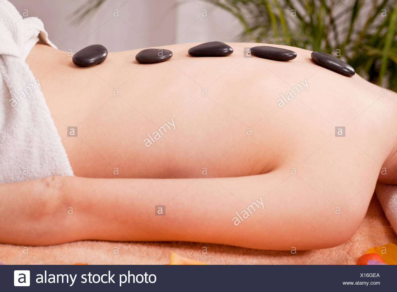 Young Attraktve Woman Gets A Hot Stone Massage Young Attraktve Woman Gets A Hot Stone Massage