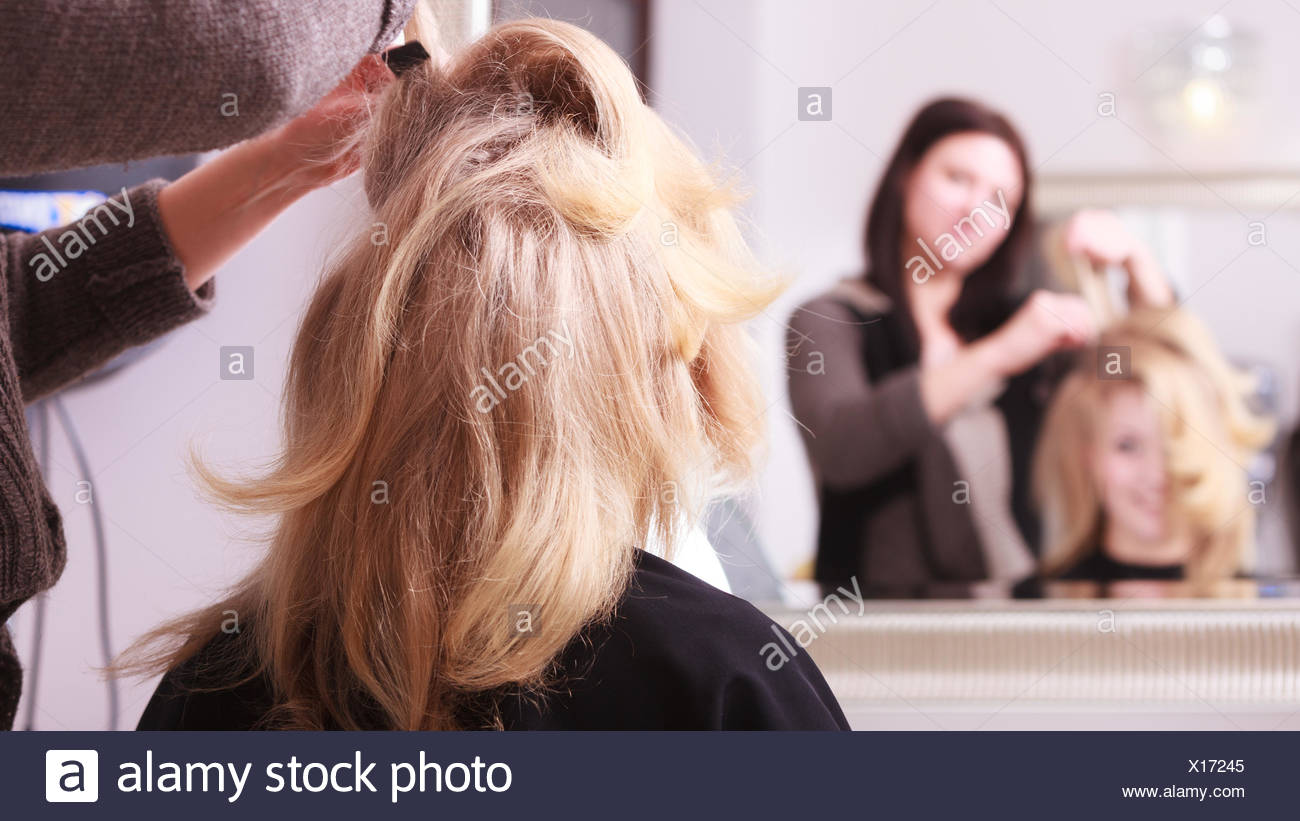 Beautiful Smiling Girl With Blond Wavy Hair By Hairdresser