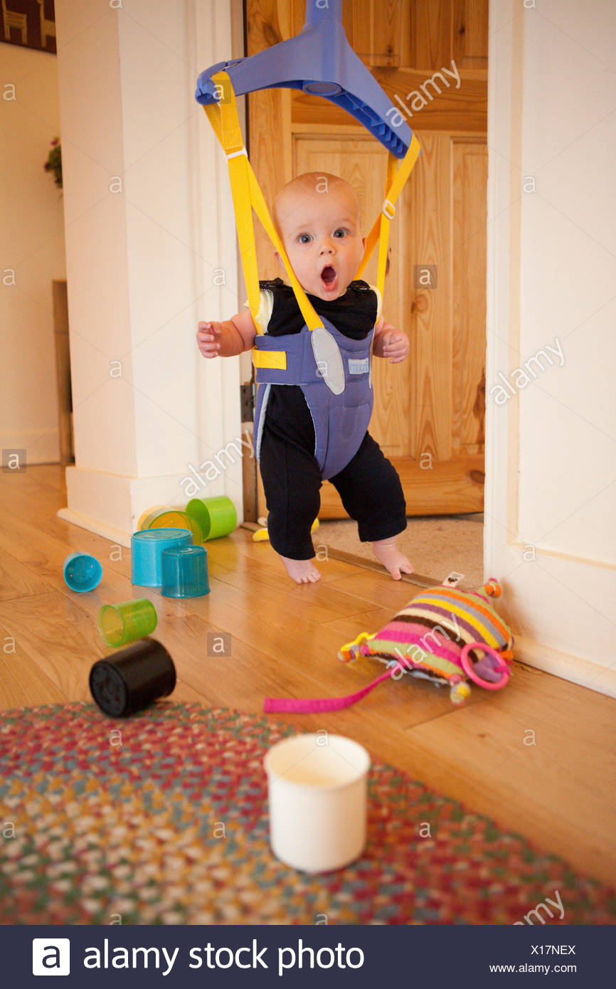 Baby in a door bouncer Stock Photo 