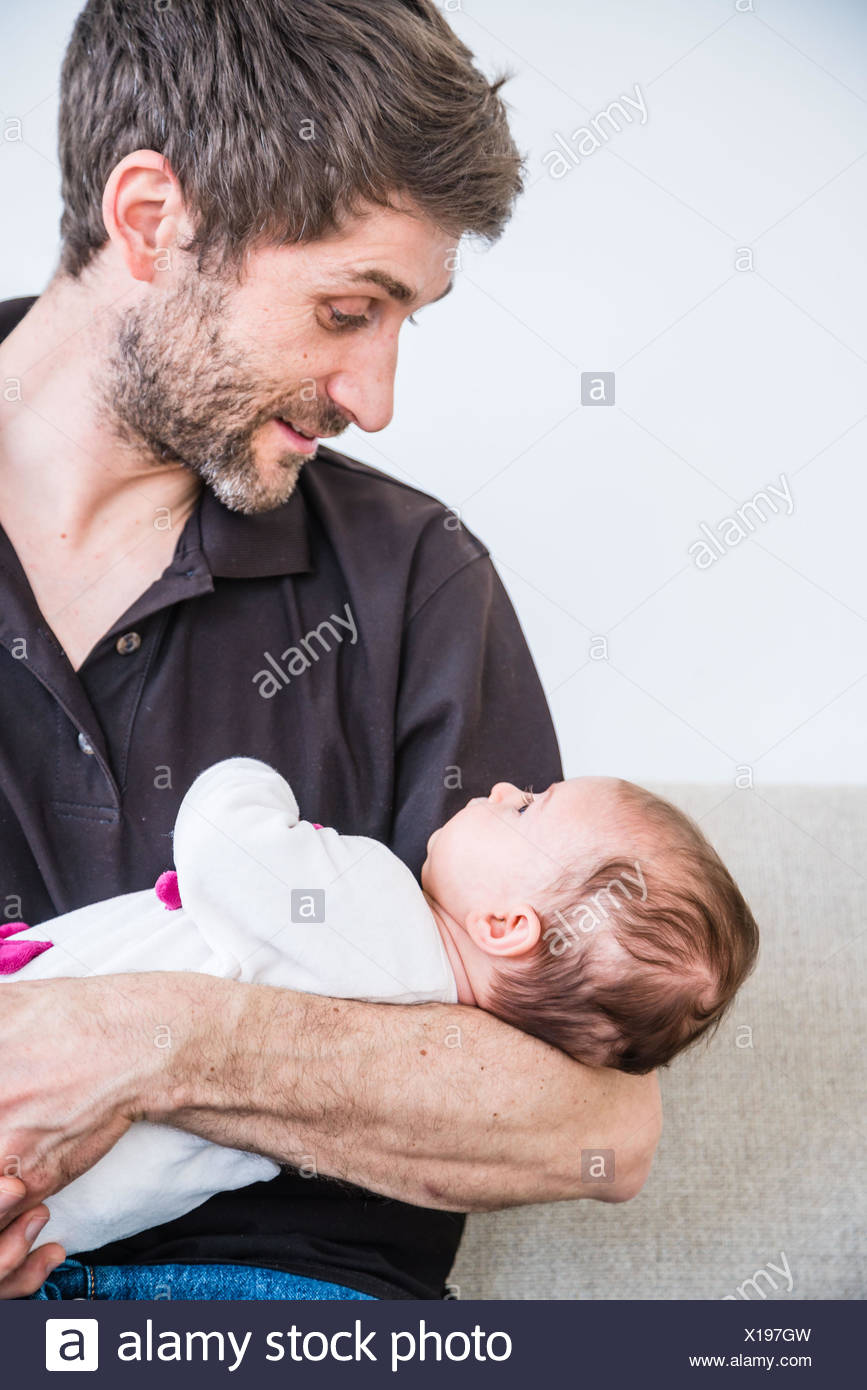 3 Month Baby Girl In The Arms Of Her Father Stock Photo Alamy