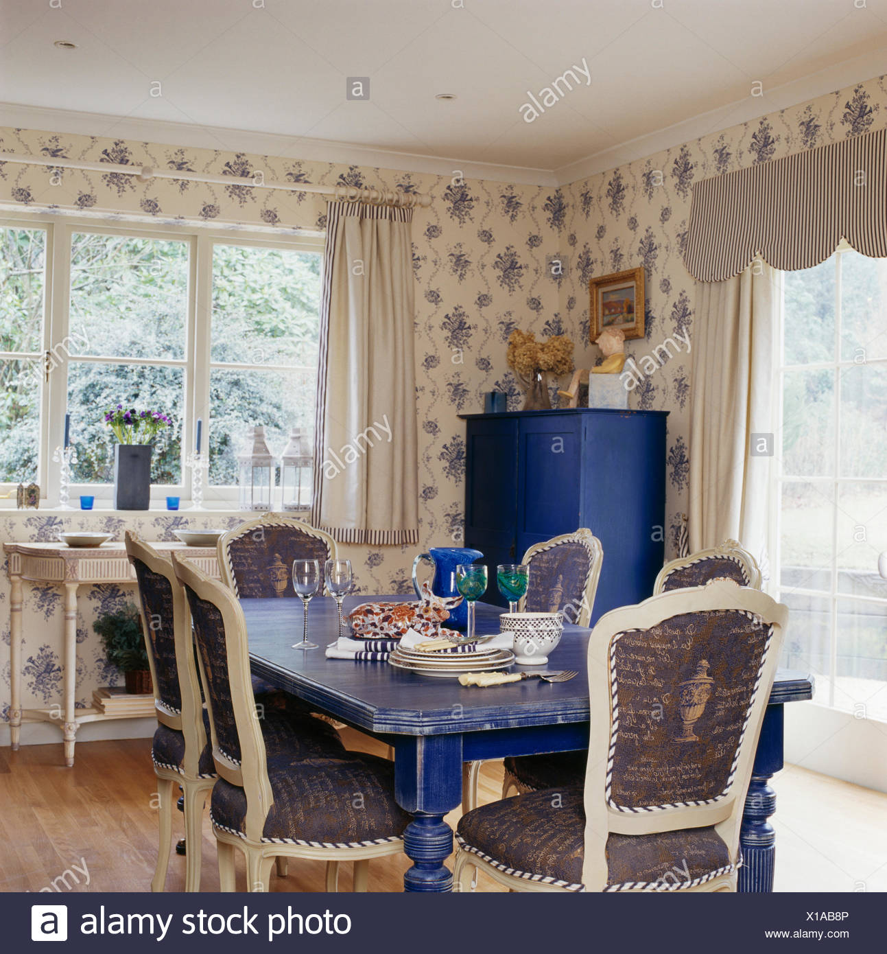 Upholstered White Chairs And Painted Blue Table In Country Dining