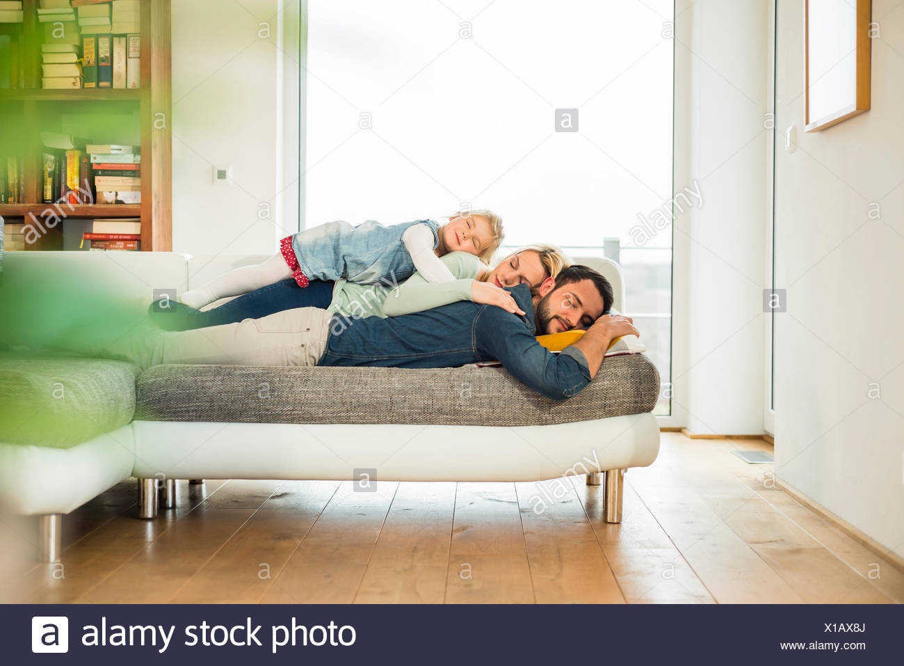 Mother Daughter Sleeping On Couch Stock Photos & Mother Daughter