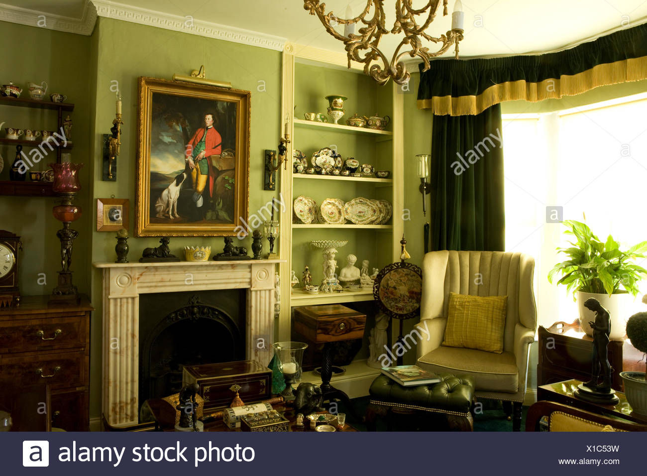 Traditional Green Drawing Room With Antique Furniture Stock Photo