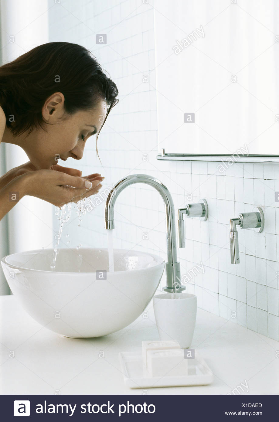 Woman Bending Over Sink Washing Face Stock Photo 276274165