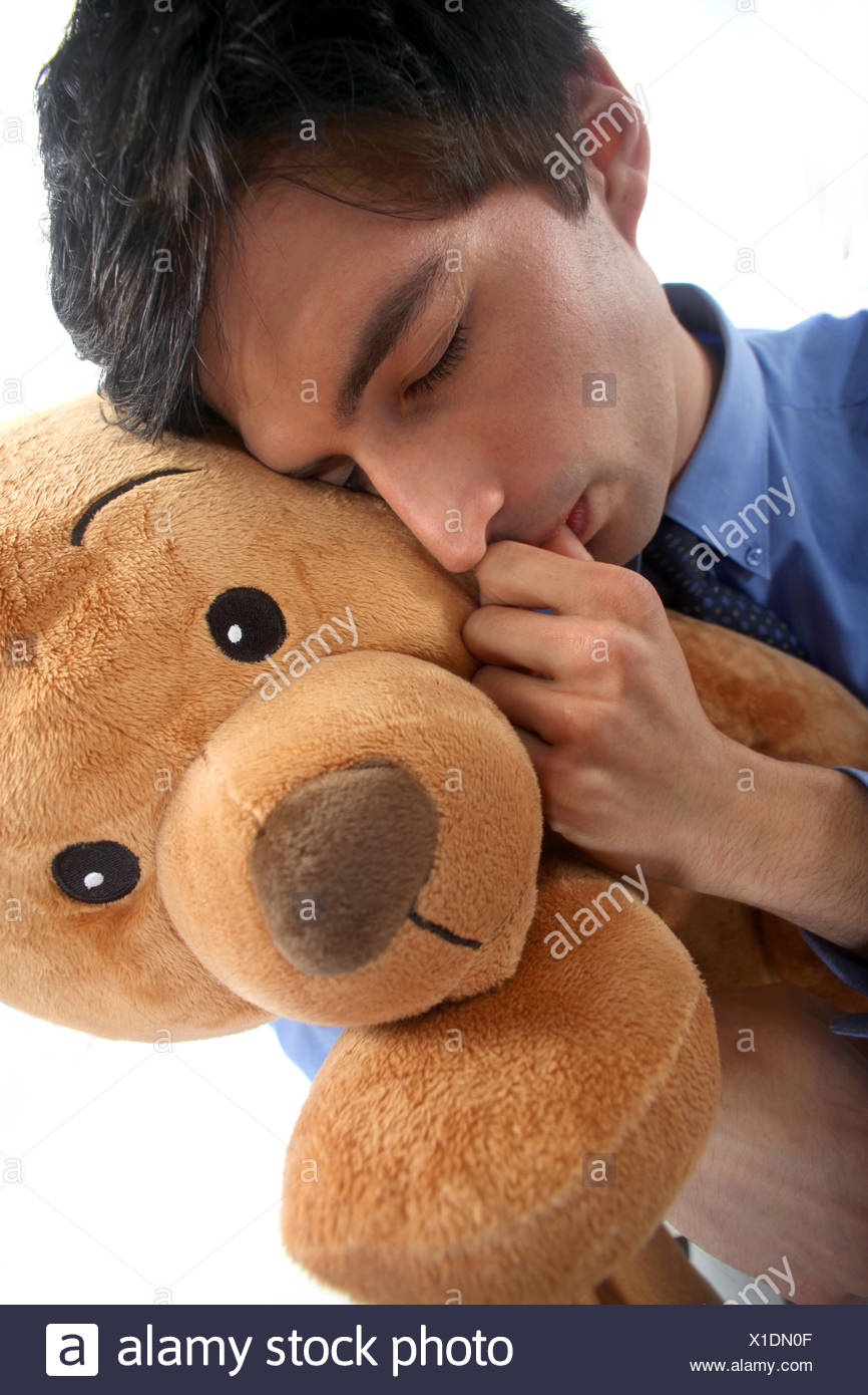 man-hugging-a-teddy-bear-X1DN0F.jpg