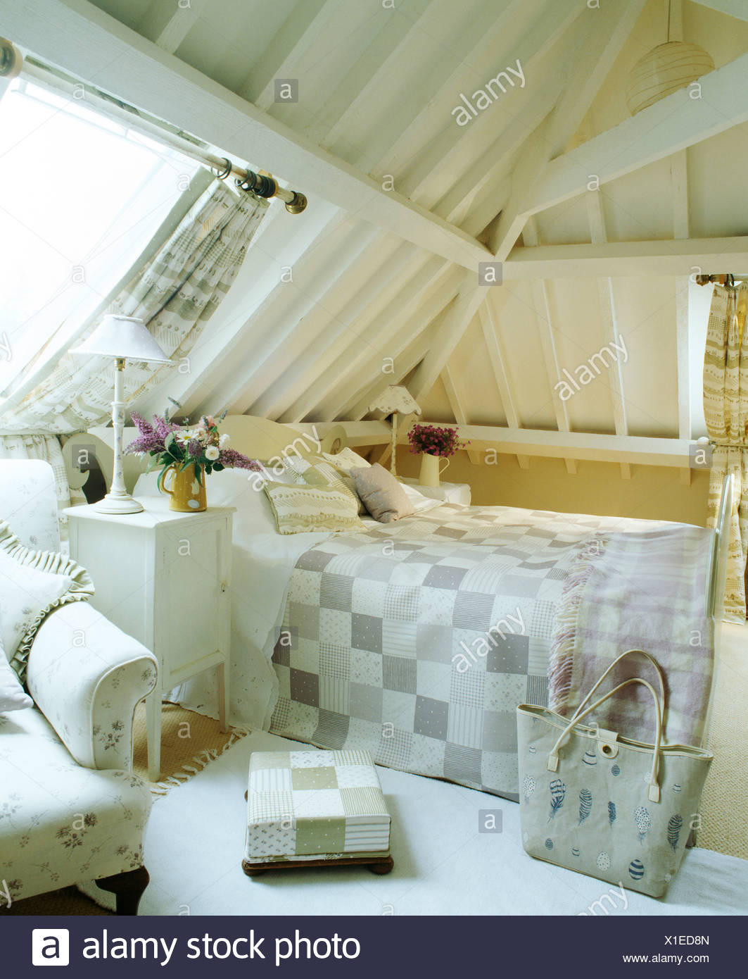 White Painted Beams And Sloping Ceiling In Country Loft