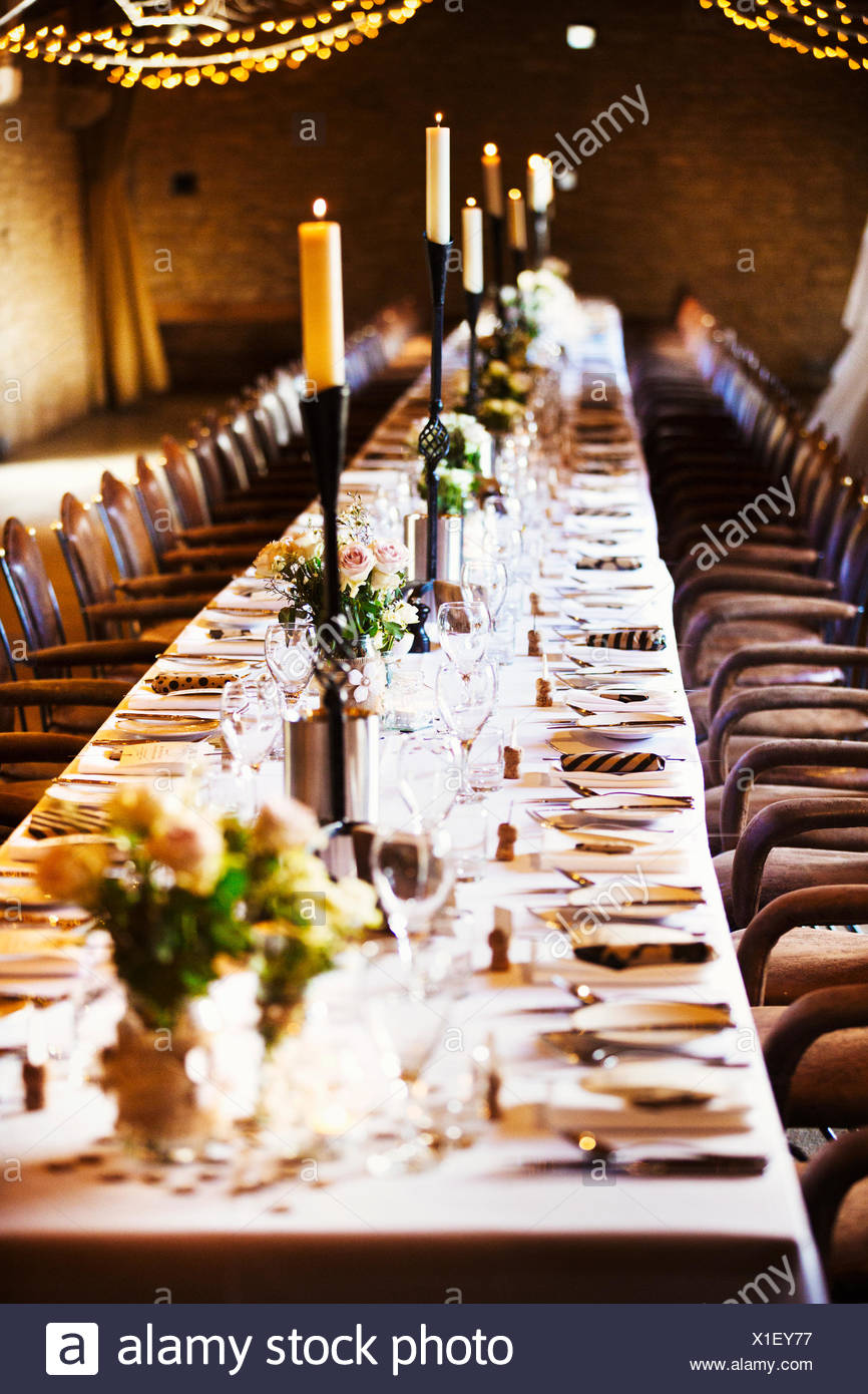 A Wedding Venue Decorated For A Party With Fairy Lights And A