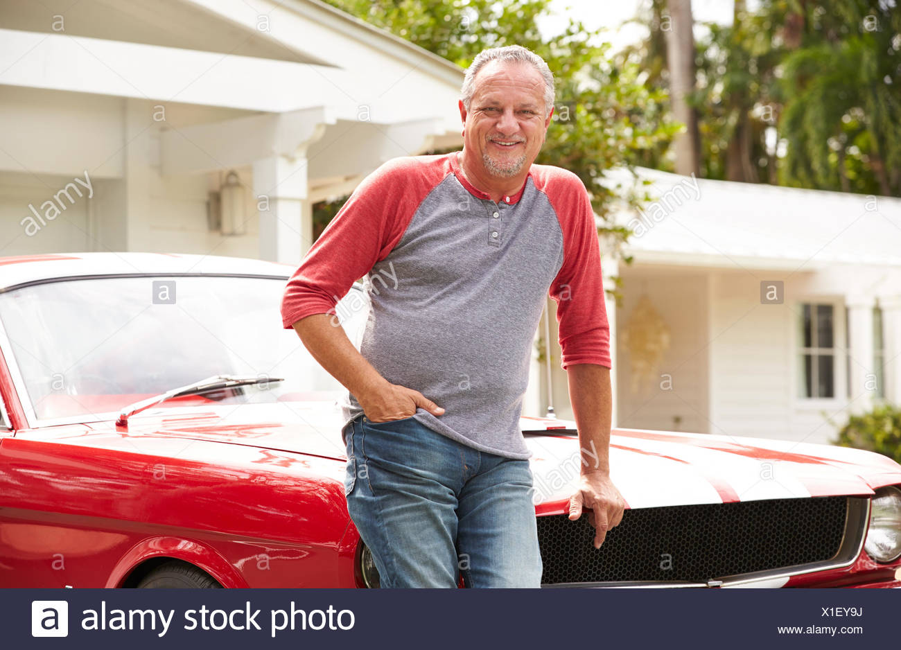 Retired Senior Man Standing Next To Restored Classic Car Stock Photo Alamy
