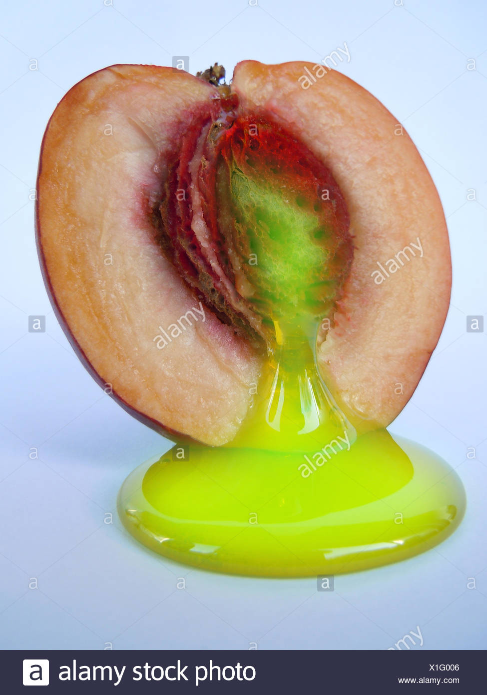 accident atom kernel green accident atom radiation nuclear fission kernel peach Stock Photo