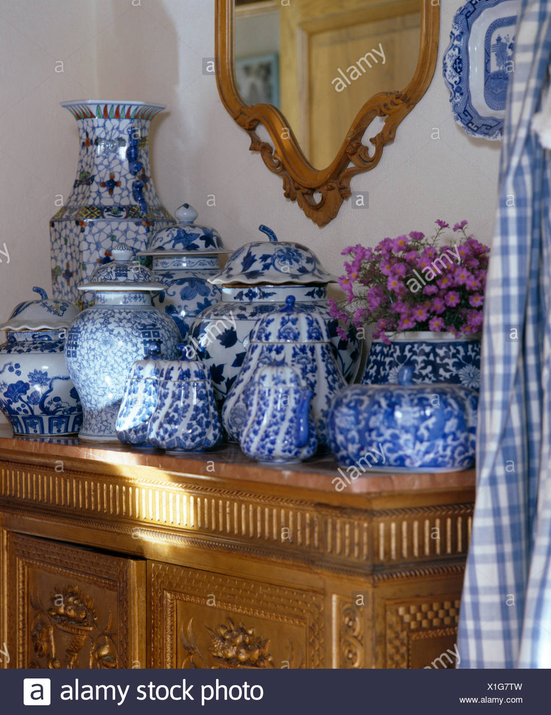 Close up of collection of blue white vases and Chinese pots close up of collection of bluewhite vases and chinese pots on antique cupboard X1G7TW