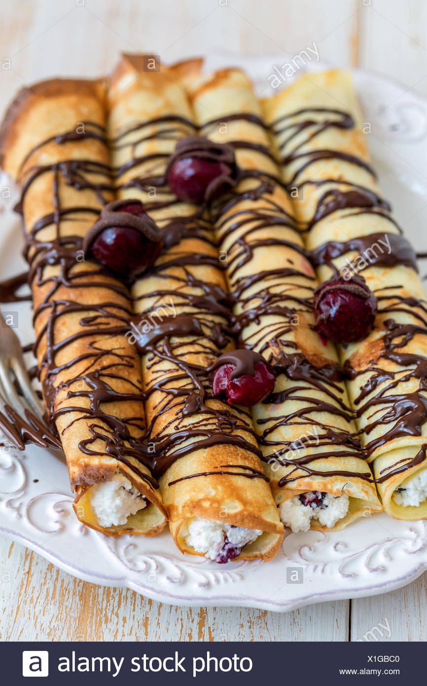 Delicious Crepes With Cottage Cheese And Cherry Stock Photo