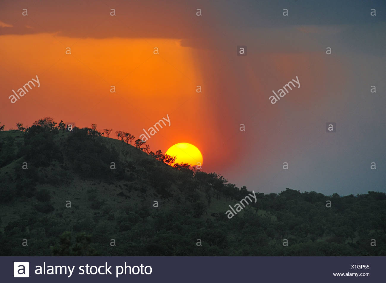 Setting sun over hills of Boma National Park, Sudan Stock Photo