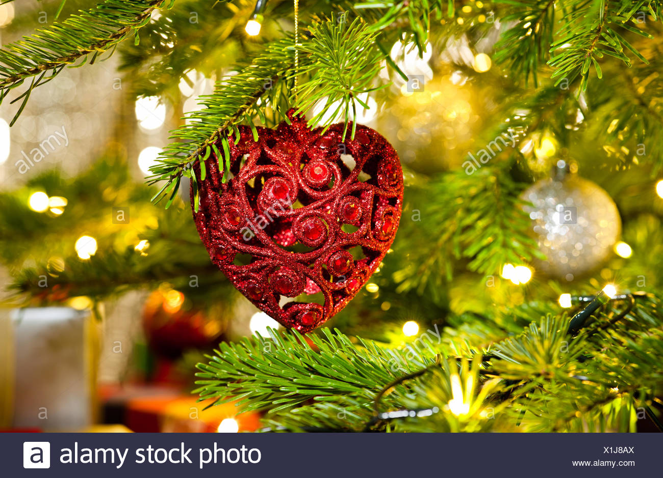 Xmas Ornament In A Real Christmas Tree In Bright Color Stock Photo