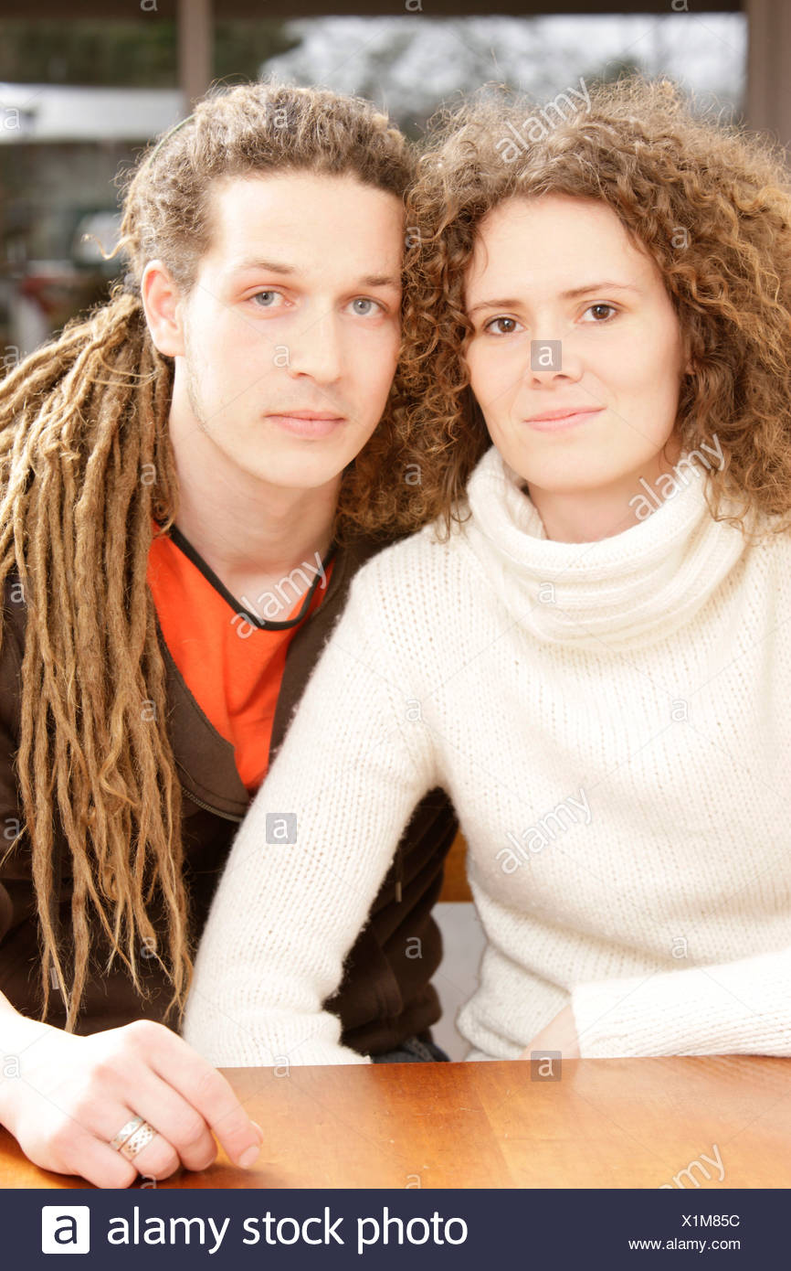 Woman With Curly Hair And A Man With Dreadlocks Stock Photo
