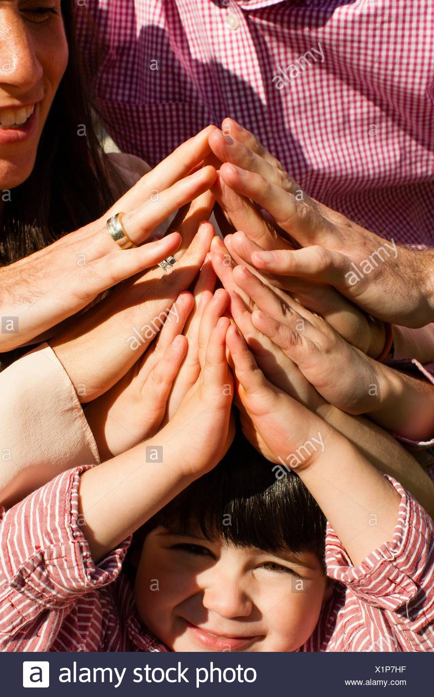 Cropped View Of Family Group Holding Hands Together Stock Photo Alamy