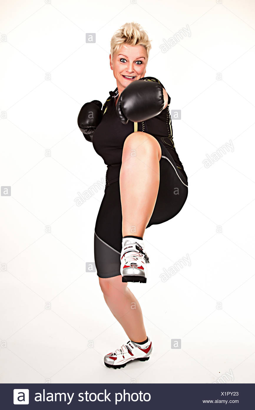 middelaged fitness woman boxing wearing boxing gloves and having fun Stock Photo