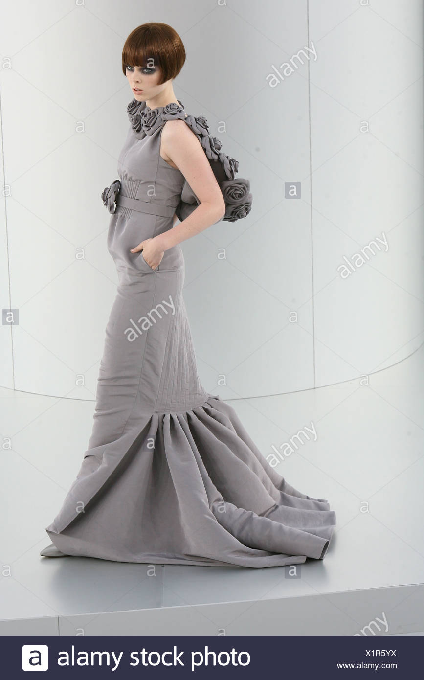 Chanel Prive Paris Haute Couture Autumn Winter Model Wearing A Flolength Grey Fishtail Dress Fabric Flower Hood And Belt Stock Photo Alamy
