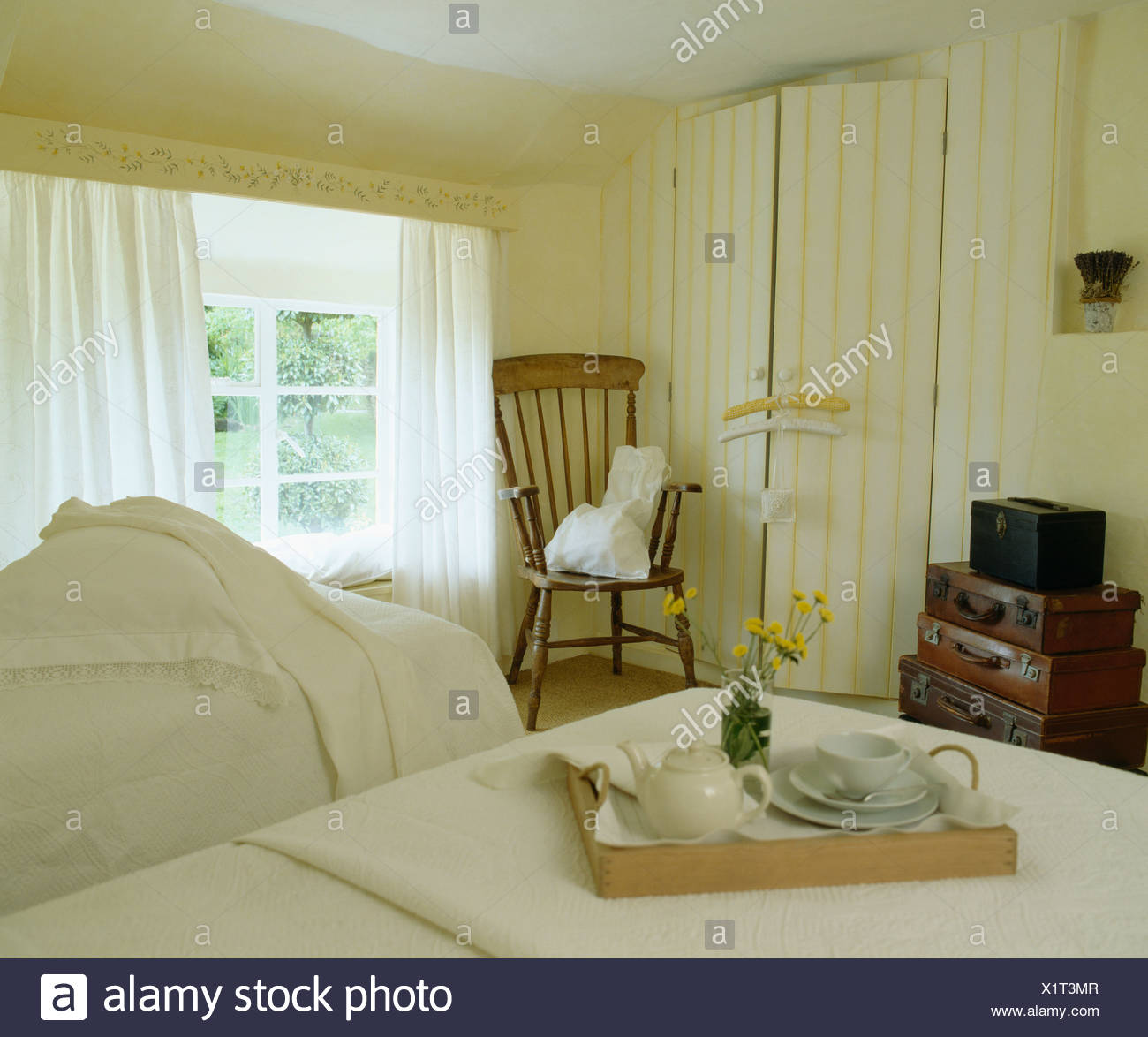 Twin Beds In Bedroom With Breakfast Tray In Cream Country