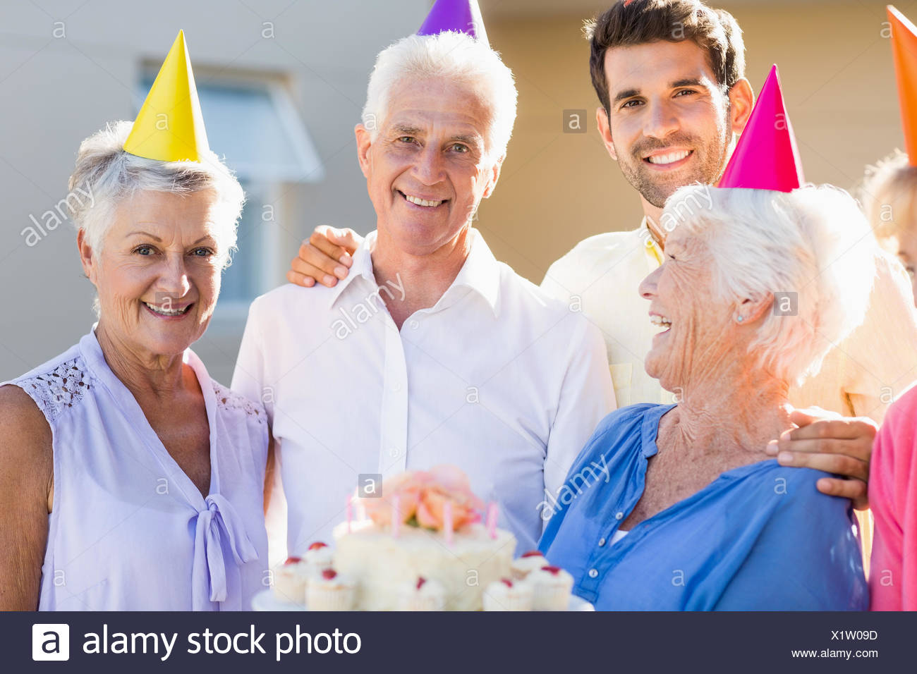 Nurse And Seniors Celebrating A Birthday Stock Photo 276529609