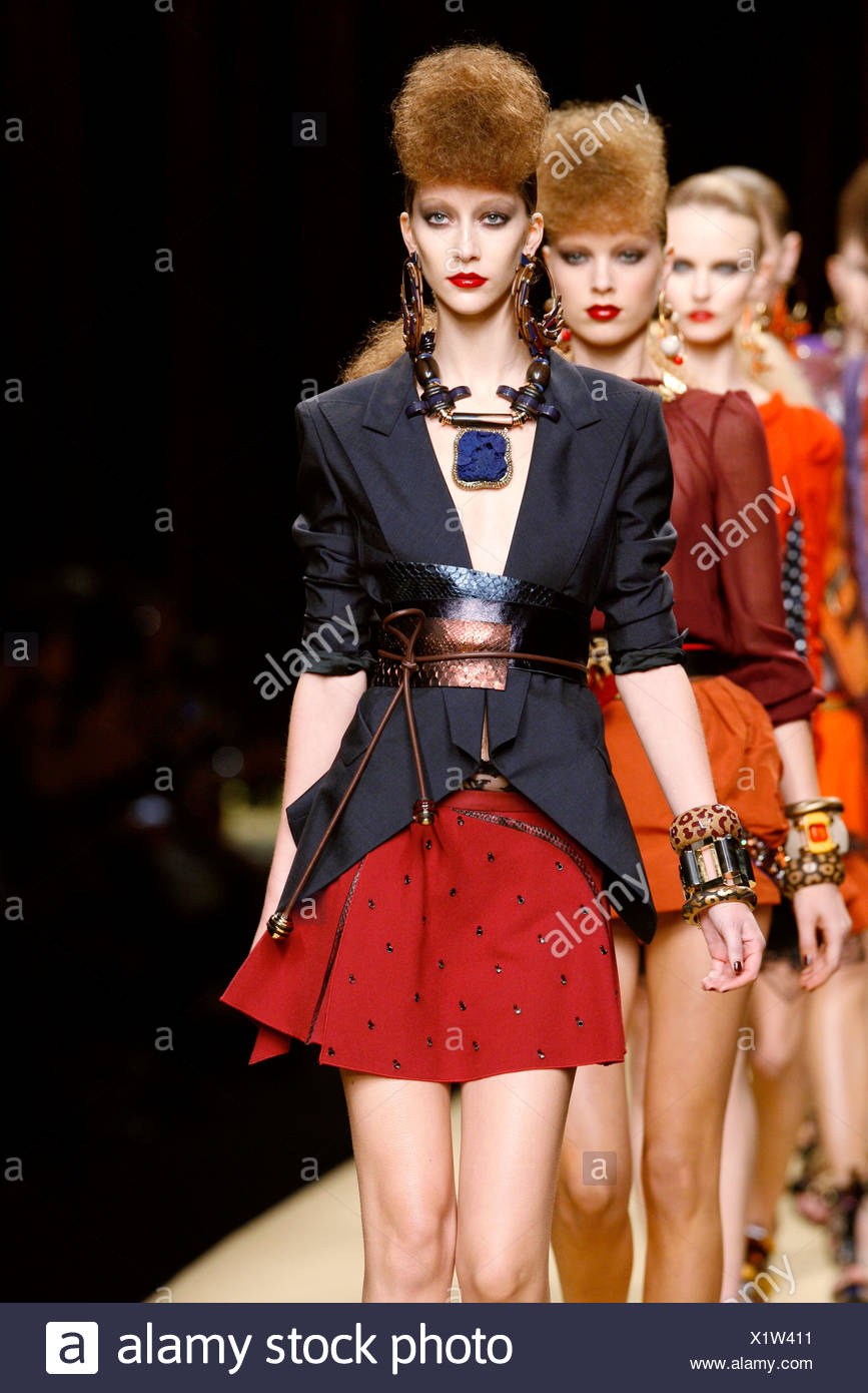 Model Backcombed Hair Wearing A Black Jacket Sleeves Gathered