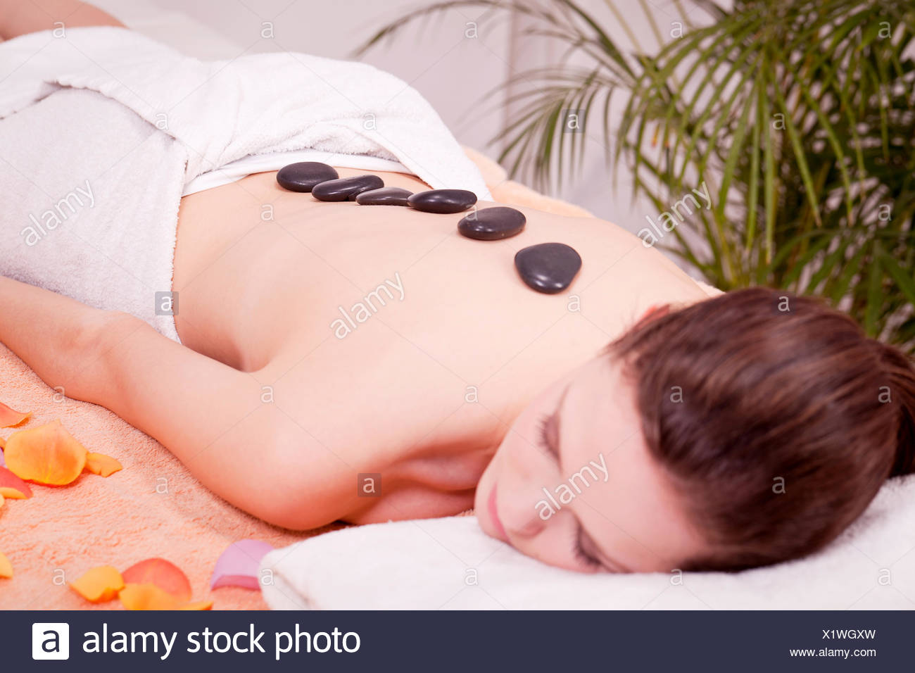 Young Attraktve Woman Gets A Hot Stone Massage Young Attraktve Woman Gets A Hot Stone Massage