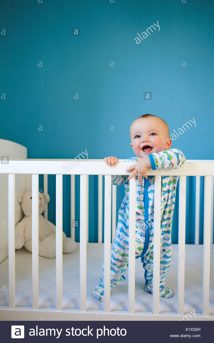 Toddler Standing Up In Crib Stock Photo 276551369 Alamy