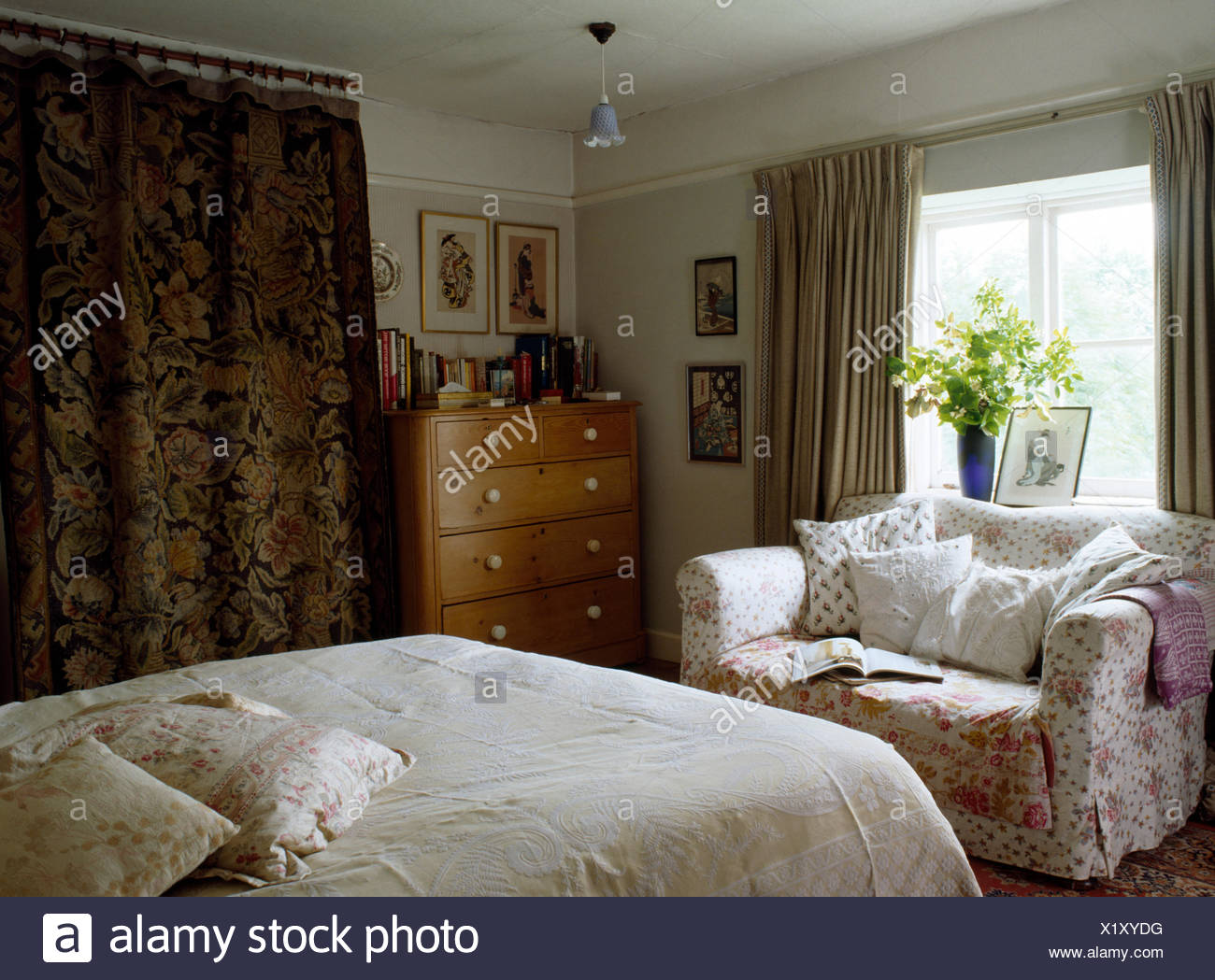 Small Sofa In Eighties Cottage Bedroom With Large Antique