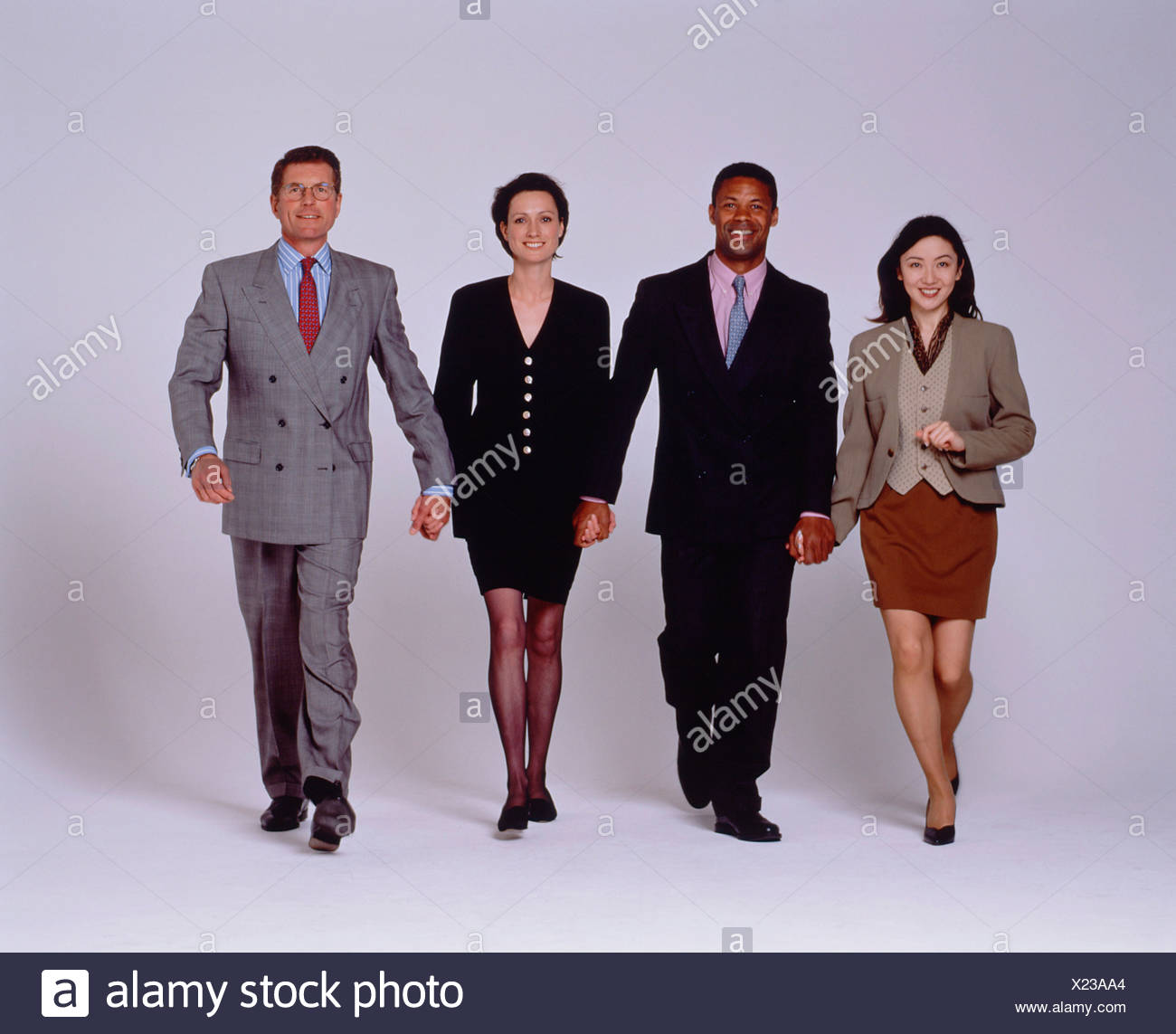 Studio Image Of A Team Of Four People Two Men And Two Women