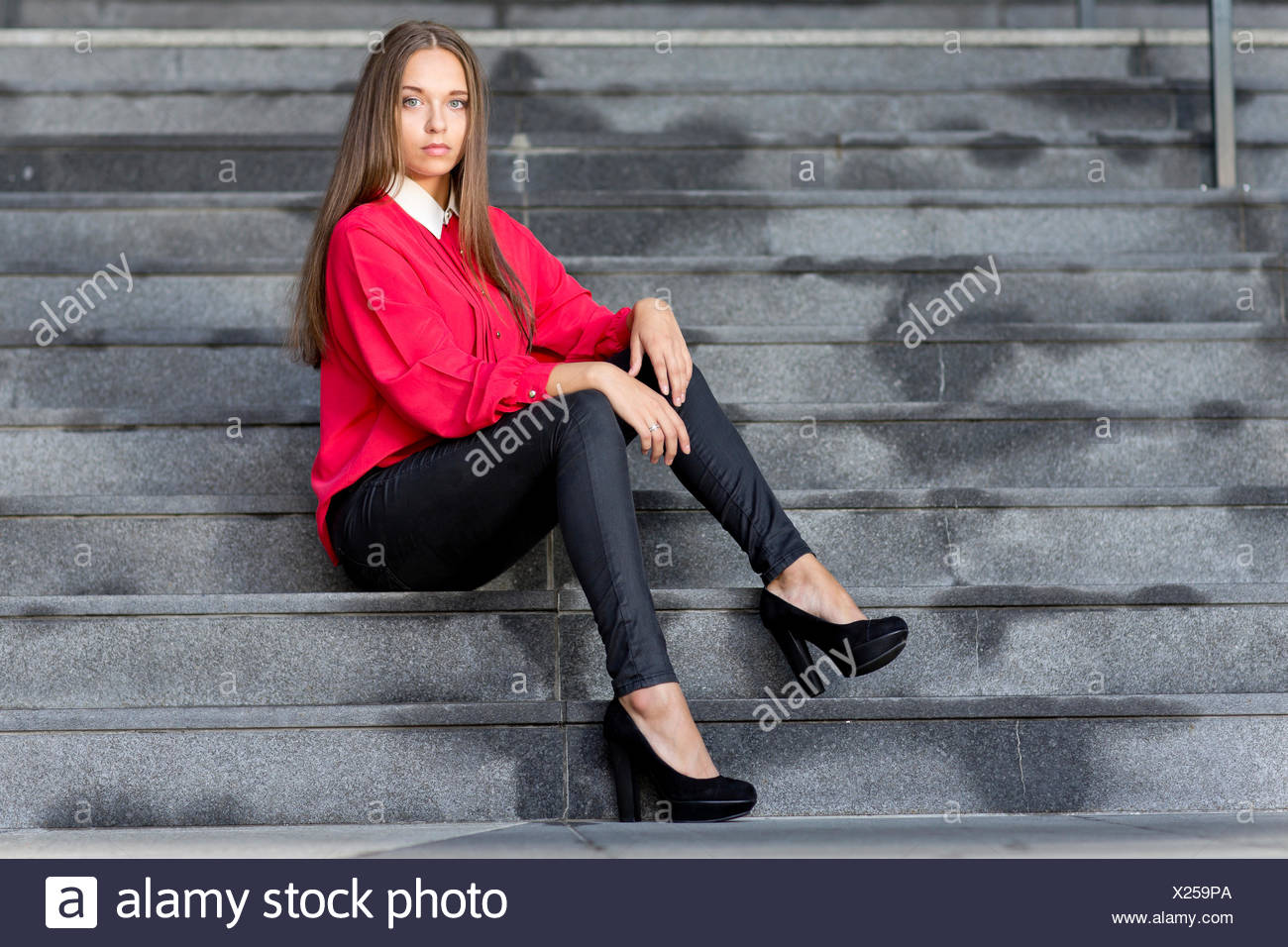 red top with black jeans