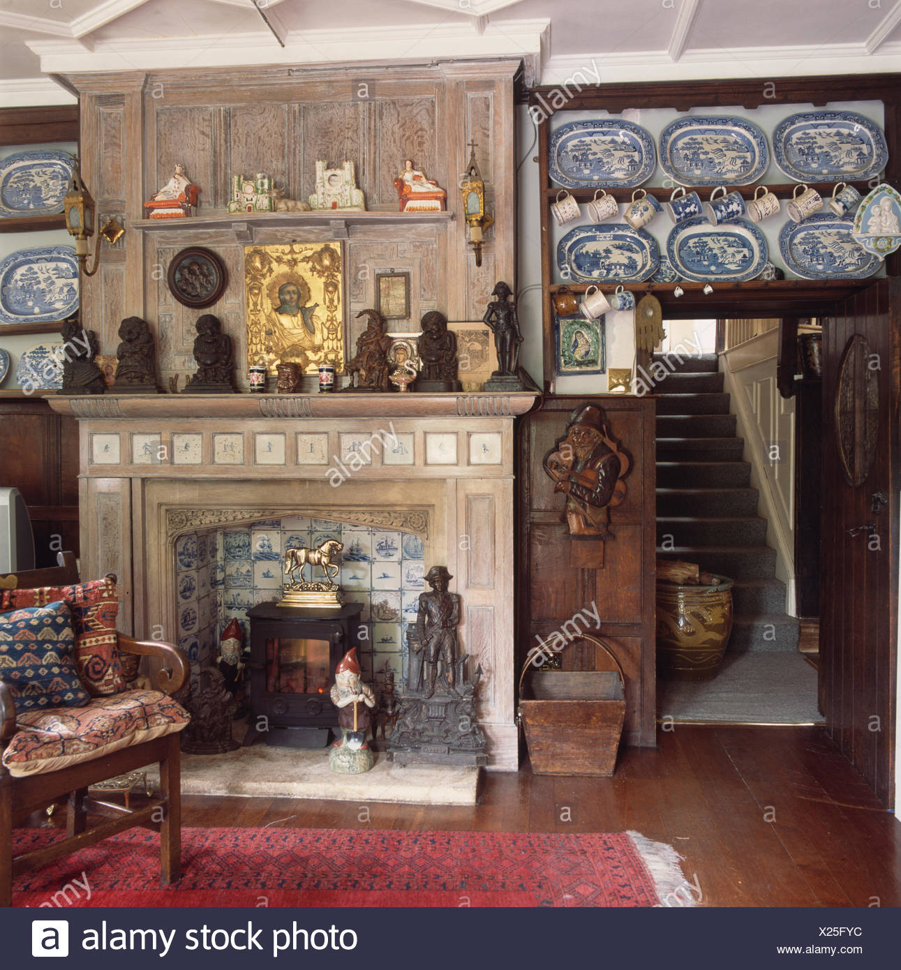 Panelled Fireplace In Country Livingroom And Blue And White Plate
