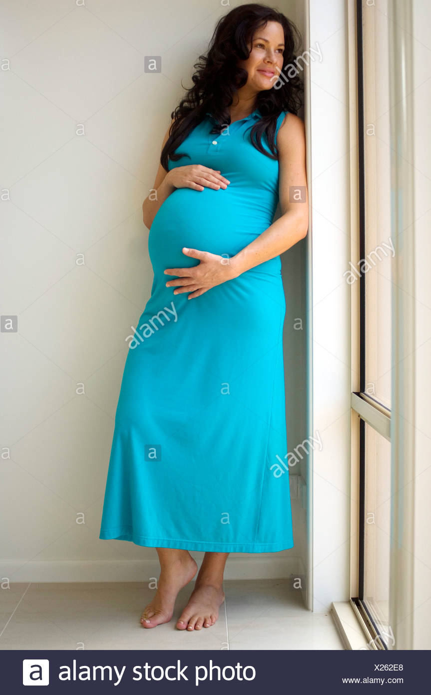 Pregnant Female With Long Curly Brunette Hair Turquoise Blue