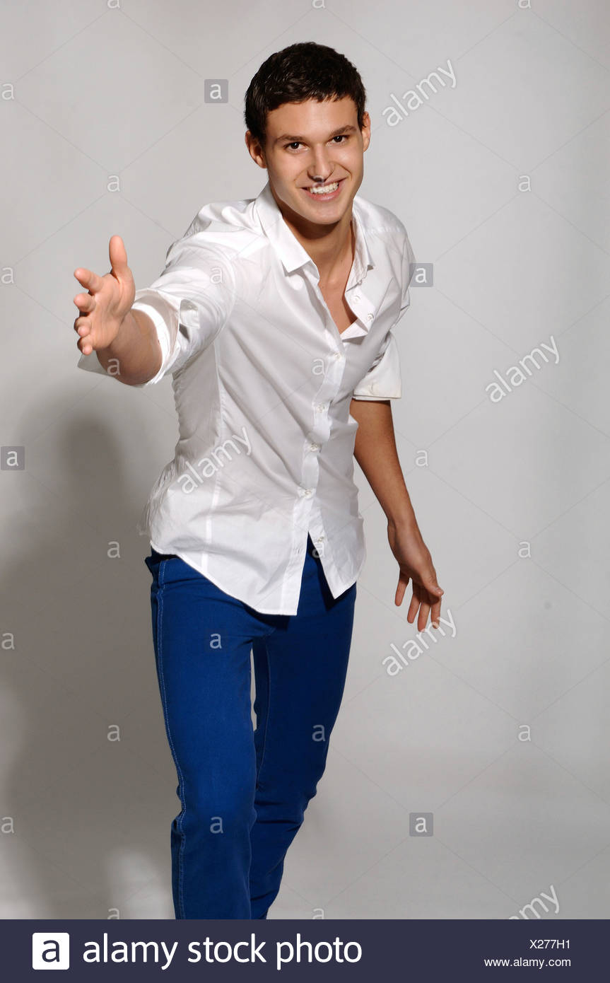 man in white shirt and blue jeans
